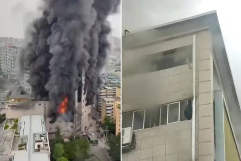 &Ccedil;in'de alevlere teslim olan binanın &ccedil;atısında mahsur kalanlar hastaneye kaldırıldı